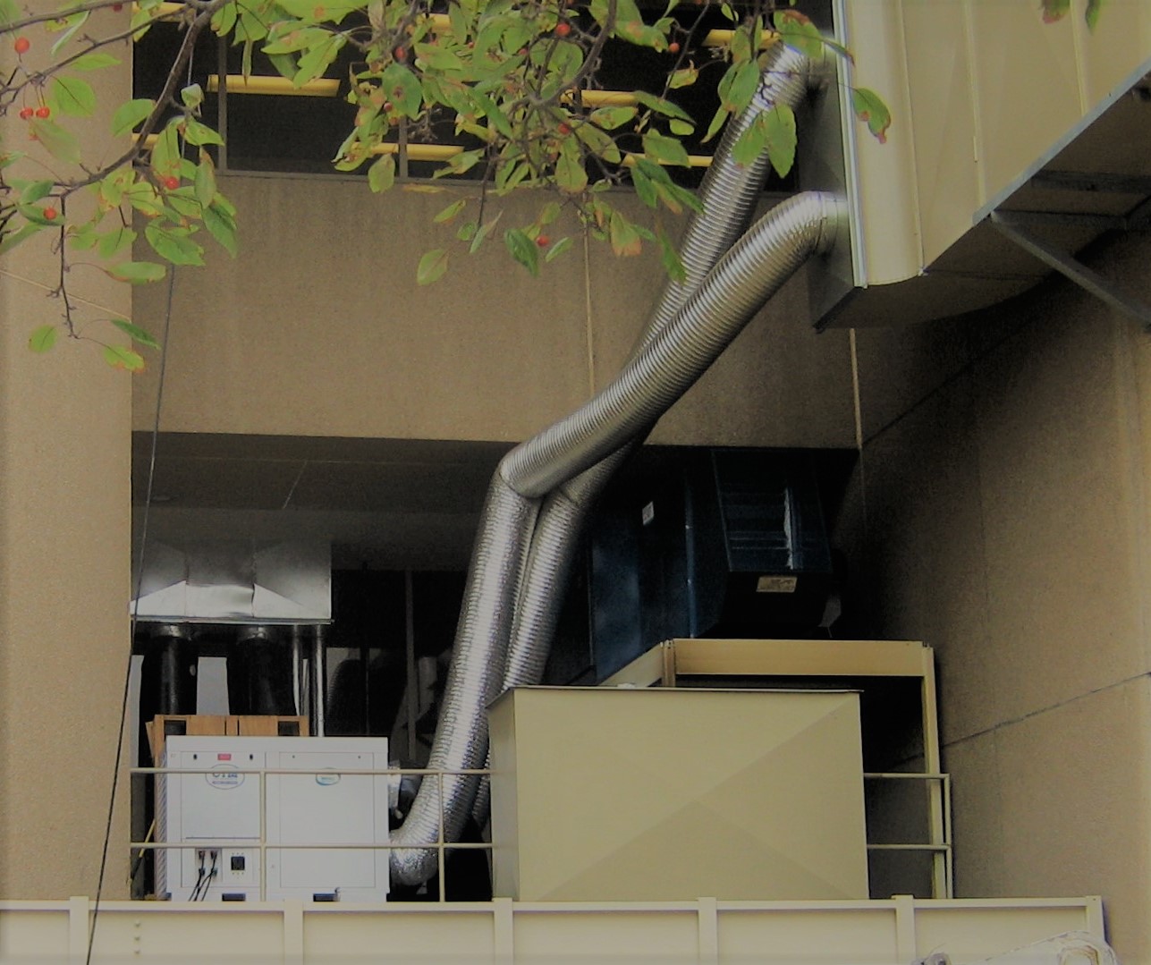 Portable Air Conditioner with ductwork going into a building